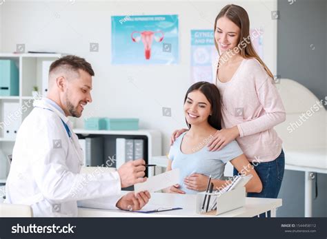 Lesbian Couple Visiting Male Gynecologist Clinic Stock Photo 1544458112