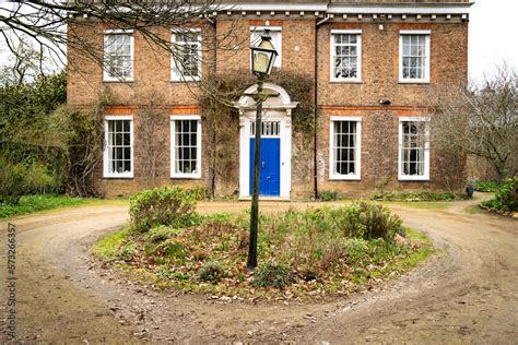 Foto De Front Aspect View Of An Old Manor House Showing A Circular