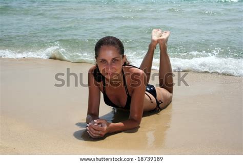 Playful Brunette Model Lying On Beach Stock Photo 18739189 Shutterstock