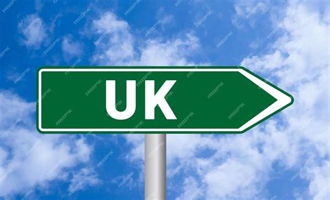 Premium Photo Uk Road Sign On Cloudy Sky Background