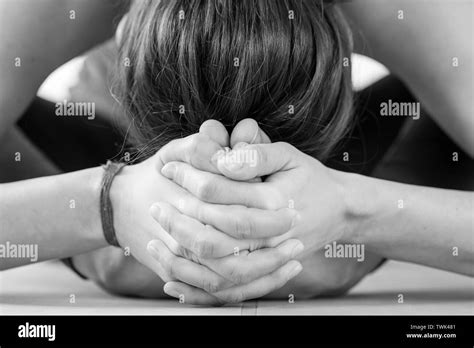 Horizontal Close Up Of A Brunette European Woman Clenching Her Feet Together Near The Top Of Her