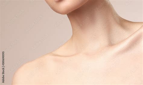 Asian Women S Neck And Collarbone On A Nude Background Stock Photo Adobe Stock