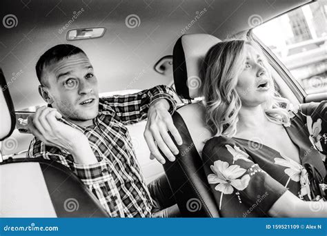 Black And White Photo Of Surprised Blonde Driver And Passenger Man In Taxi Stock Image Image