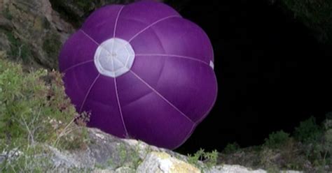 Watch Man Pilot Hot Air Balloon Into Underground Cave