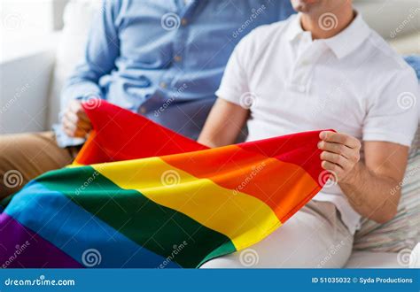 Close Up Of Male Gay Couple Holding Rainbow Flag Stock Photo Image Of Hugging Concept