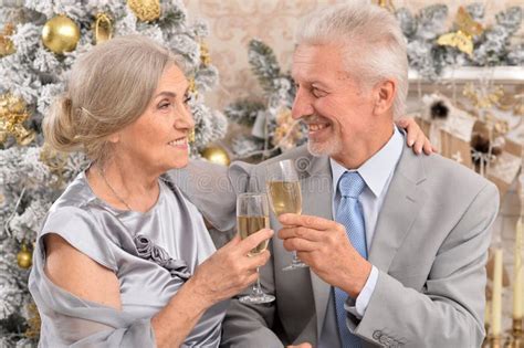 Couple Old And Mature Seniors Enjoying And Having Fun Together Celebrating The New Year Stock