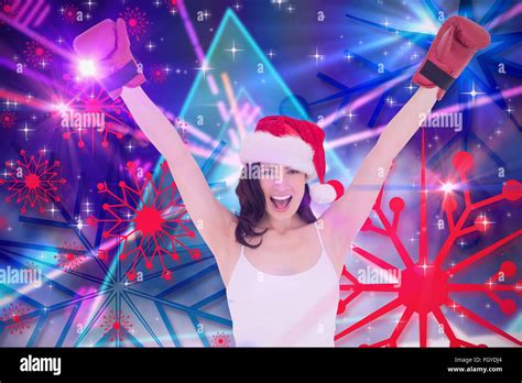Composite Image Of Festive Brunette In Boxing Gloves Cheering Stock