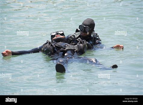 Commercial deep sea diver training simulating a rescue situation One ...