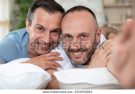 Happy Gay Couple Lying On Bed Stock Photo Shutterstock