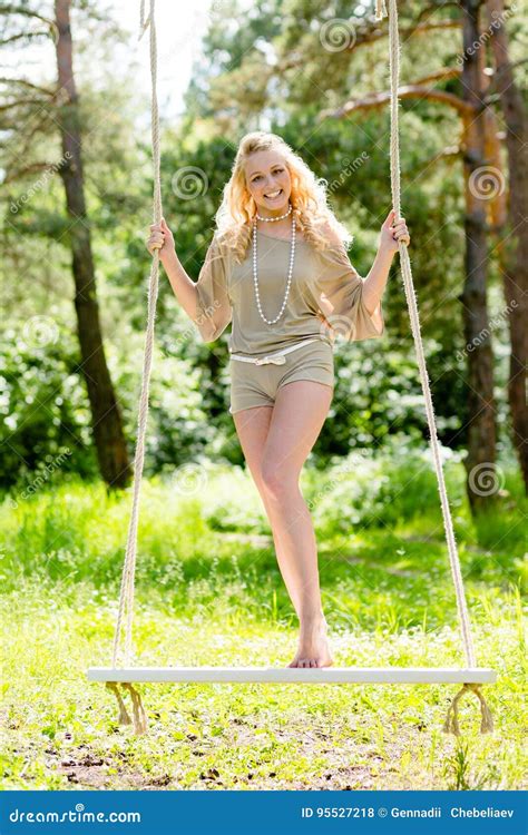 Beautiful Blonde Woman Swinging On The Rope Swing Stock Photo Image Of Naked Swing 95527218
