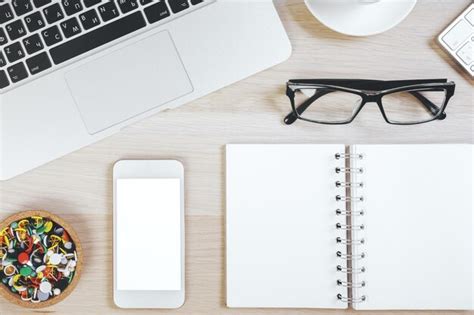 Premium Photo | Modern wooden desk top with items
