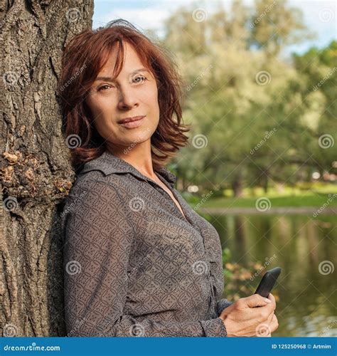 Mature Woman Outdoors Portrait Mid Adult Woman Stock Photo Image Of Calling Cell