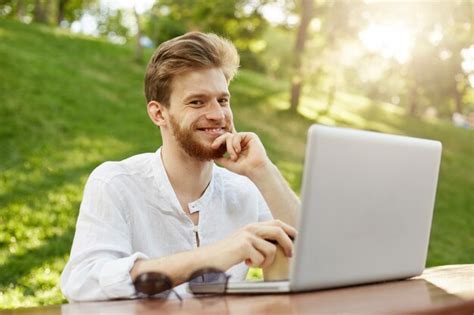 Free Photo Mature Ginger Handsome Man With Laptop Computer In The Park
