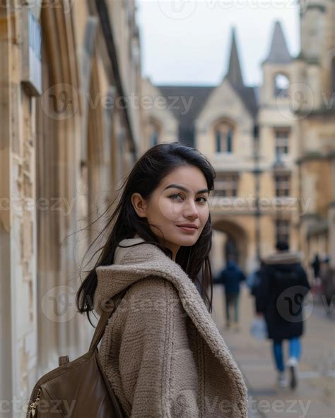 young woman in warm coat exploring historic city 53182024 Stock Photo