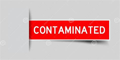 inserted red label sticker  word contaminated  gray background