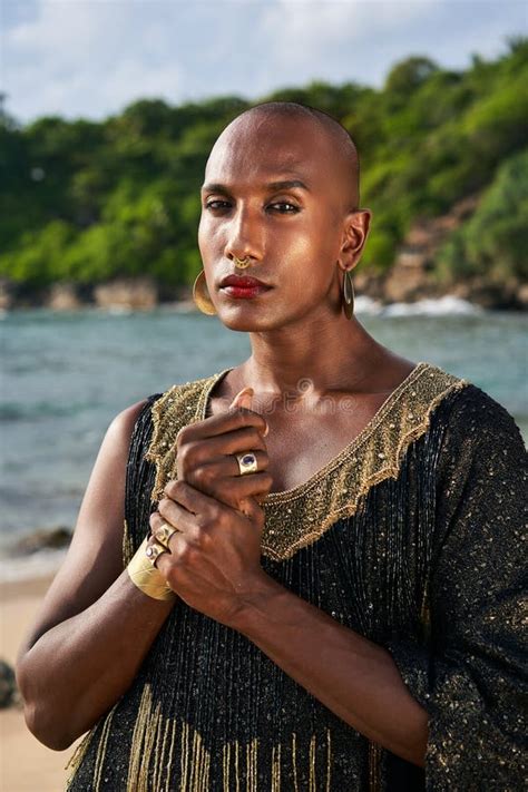Gorgeous Gay Black Man In Luxury Gown Jewelry Poses On Scenic Ocean Beach Non Binary Ethnic