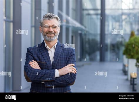 Portrait Of Mature Gray Haired Businessman Senior Boss Smiling And