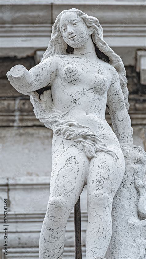 Ancient Aged Sculpture Of Beautiful Naked Venetian Renaissance Era Woman At Basilica Di Santa
