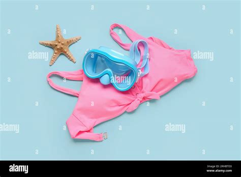 Swimming Mask Starfish And Bikini Bra On Blue Background Stock Photo Alamy