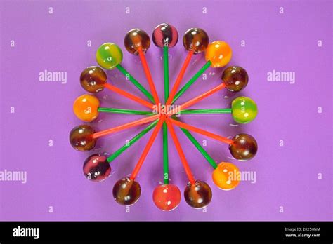 Various Colorful Lollipops On Pastel Background Bright Juicy Colored