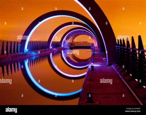 A View Of The Falkirk Wheel At Night With An Orange Glow Caused By The