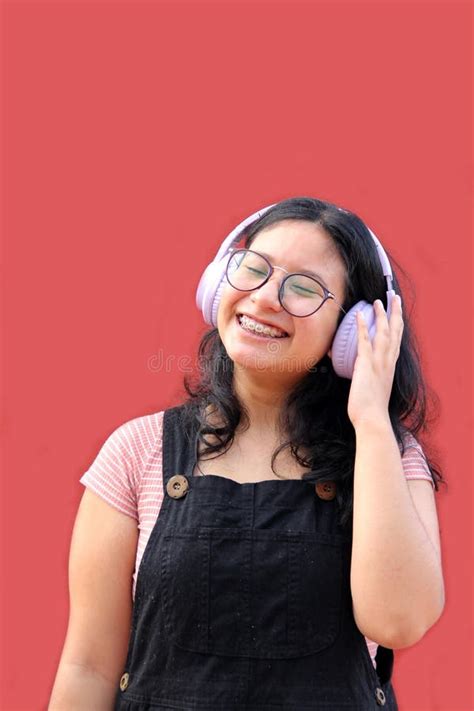 40 Year Old Latina Woman Points To Something That She Likes Surprises And Excites Such As