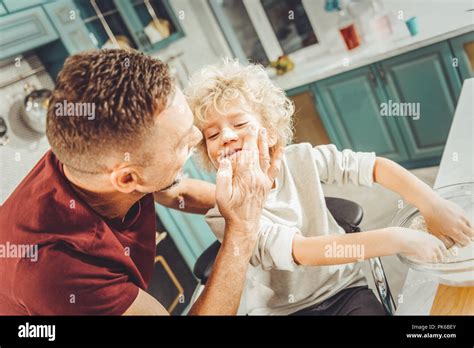 Curly Blonde Haired Boy Feeling Happy Spending Morning With Father Stock Photo Alamy