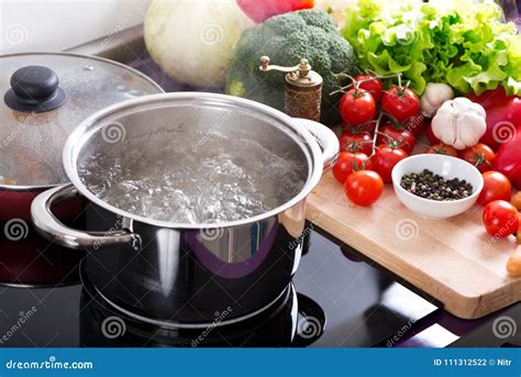 Boiling Water In A Cooking Pot On The Cooker Stock Photo Image Of