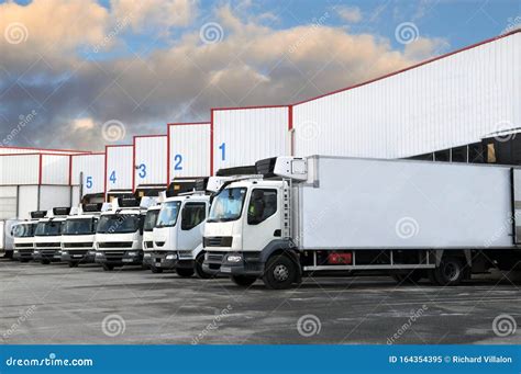 Trucks Parked In Front Of A Warehouse Stock Image Image Of Truck