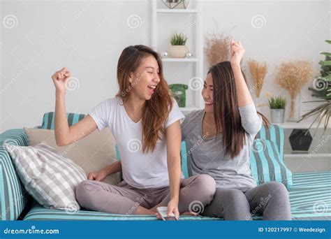 Asia Lesbian Lgbt Couple Holding Remote Watching Tv Show And Che Stock Image Image Of