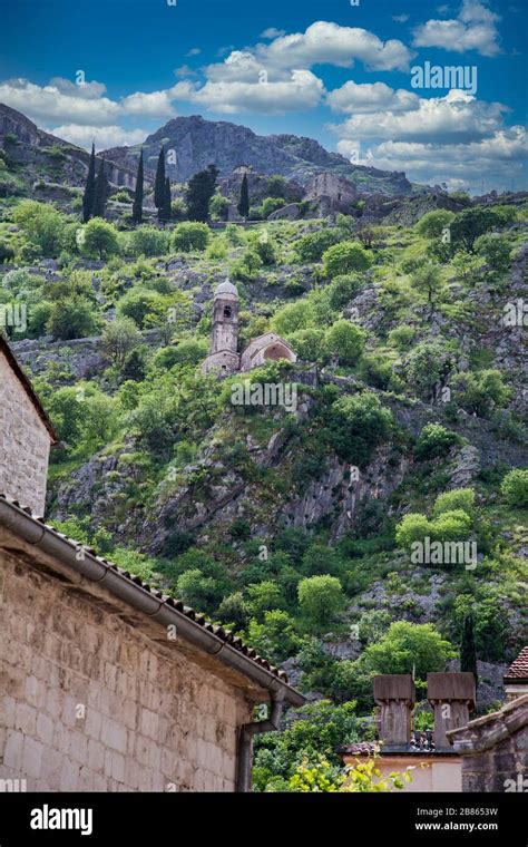 Church Domes Beneath Hills Over Kotor Stock Photo - Alamy