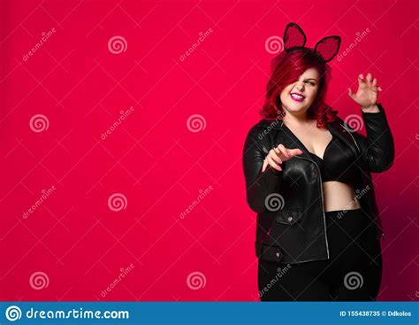 Cute Plus Size Brunette With Black Bunny Ears In Leather Jacket And Underwear Posing On Red