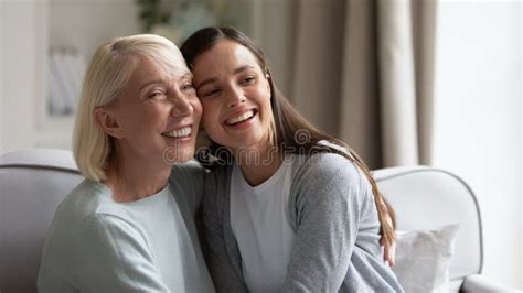 Happy Mature Grandmother And Granddaughter Hugging Having Fun Stock Photo Image Of Older