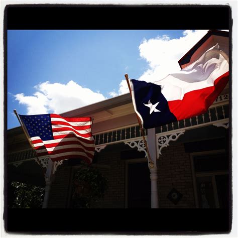 American and Texas Flags Flying High