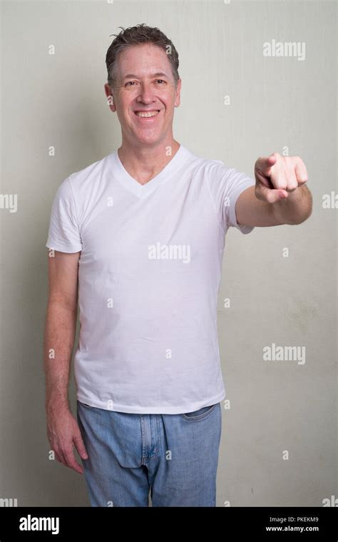 Portrait Of Mature Man With Gray Hair Against White Background Stock Photo Alamy