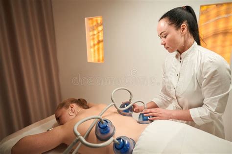 Naked Woman Lies On Massage Table With Her Back Up Stock Image Image Of Staff Specialist