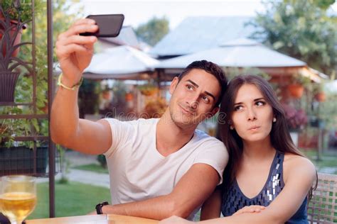 Romantic Couple On A Date At The Restaurant Taking A Selfie Stock Photo