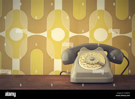 Old Fashioned Phone On Vintage Background Stock Photo Alamy