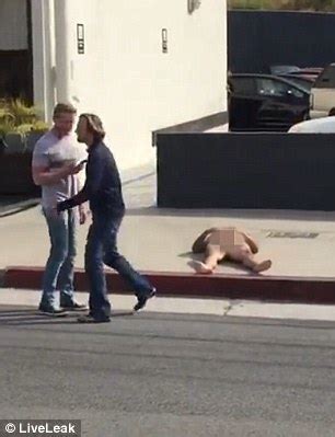 Crazed Naked Man Runs Out Onto Road And Launches Himself On Top Of A