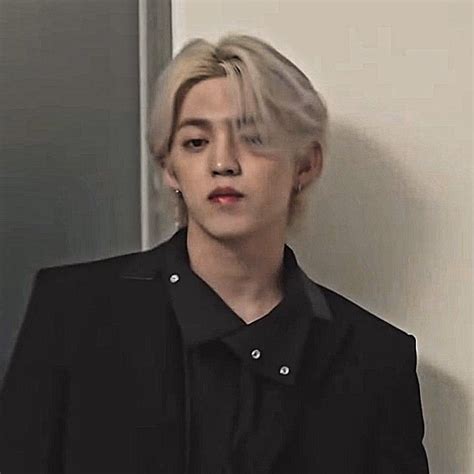 Man With Blonde Hair In Black Shirt And Blazer