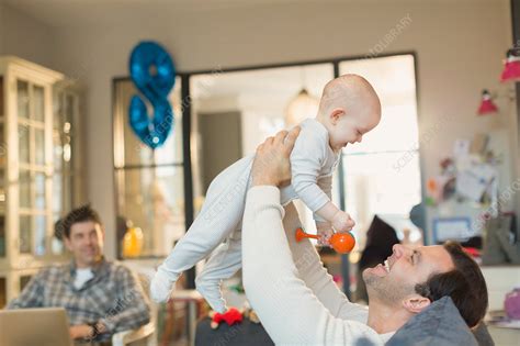 Male Gay Parents Playing With Baby Son Stock Image F018 5529 Science Photo Library