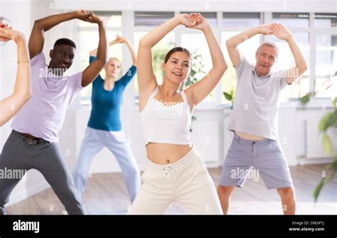 Female Instructor Teaches Mature Students Of Dance Class Basic Movements Of Hip Hop Dance Stock