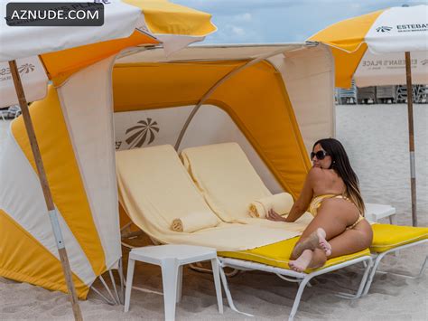 Claudia Romani Sexy On South Beach Wearing A Yellow And White Thong Bikini AZNude