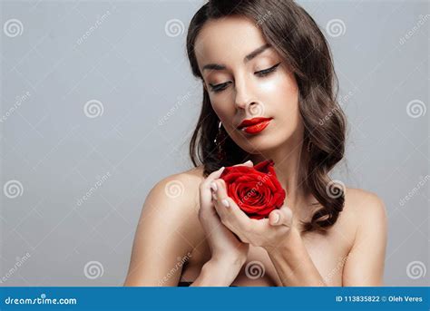 Beautiful Brunette Woman With Red Lipstick On Lips Close Up Girl With Rose Stock Photo Image