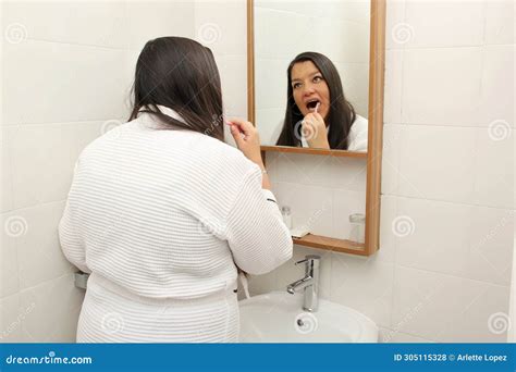 Latina Year Old Woman Brushes Her Teeth To Prevent Cavities Dressed In Bathrobe In The