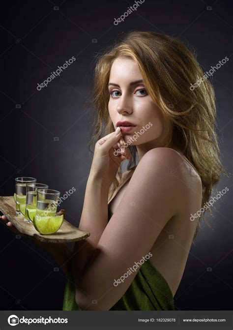 Blonde Woman With Glasses Of Tequila Stock Photo By Igorr