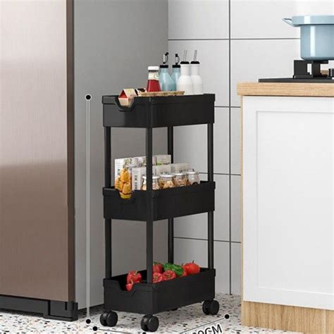 Шкаф для хранения очень узкий и имеет 3 яруса на колесиках, которые ...