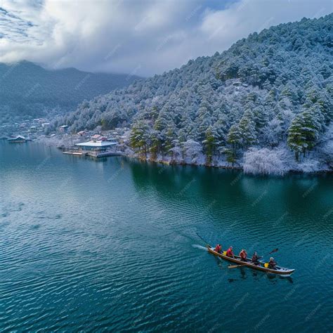 Premium Photo A Group Of People In A Small Boat On A Lake