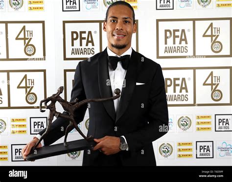 Liverpool's Virgil van Dijk poses with his PFA Team of the Year award ...