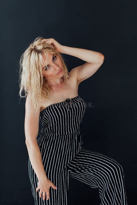Portrait Of A Beautiful Blonde Woman In Black Striped Pajamas Stock Photo Image Of Comfort